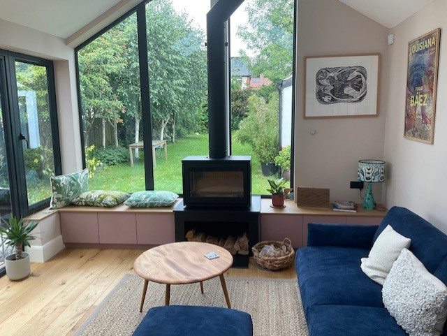 A three-sided Contura My Cube wood burning stove in a Harrogate garden room