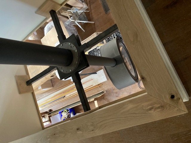 Looking down through the oak-framed opening onto the powder coated spider bracket