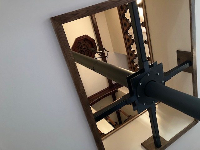 The custom steel support bracket, powder coated to match the stove