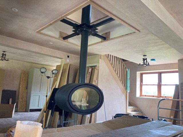 The suspended stove and twin-wall flue during the fit