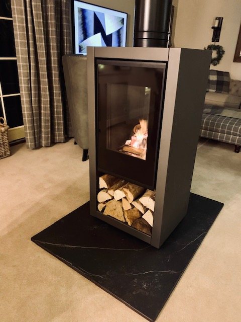 A Spartherm A8 tunnel wood burning stove with an integral log store near Helmsley