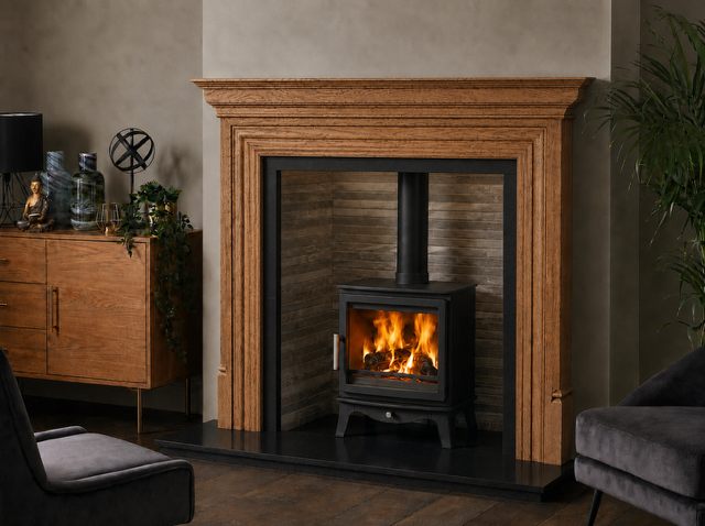 Porcelain stove chamber fitted behind a wood burning stove in a complete fireplace setting