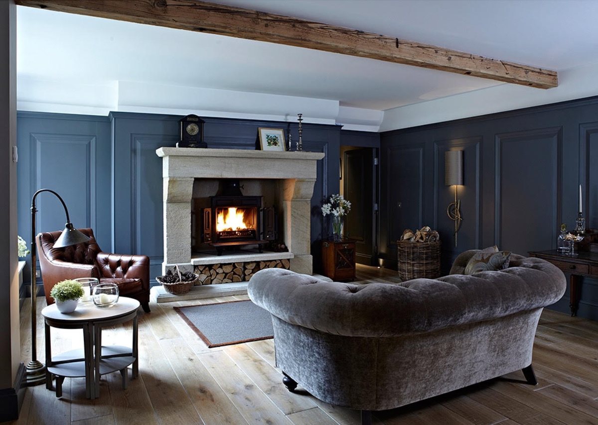 Natural stone fireplace and stove fitted as a finished room focal point by Carl Finnell