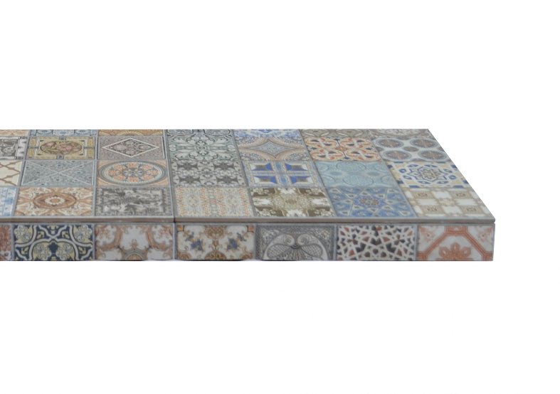 Artisan mosaic tiled hearth with patterned black and white tiles