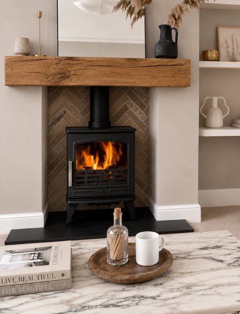 A wood burning stove on a granite hearth with an oak beam and brick chamber