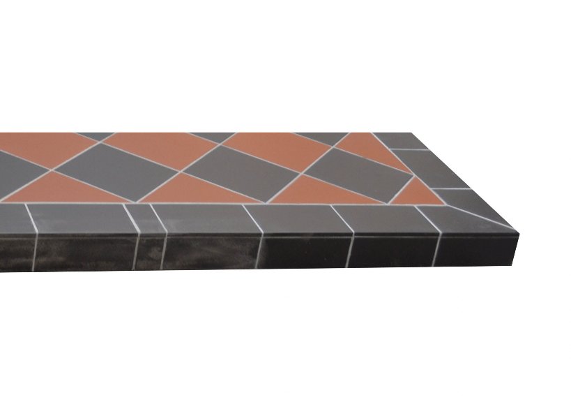 Rustic red and black quarry tiled hearth with a traditional quarry tile pattern