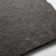 Black flagstone hearth with pitched edges