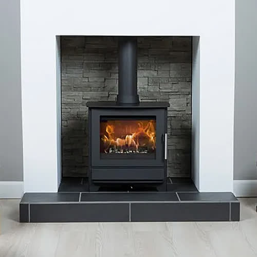 Heta Inspire 45 wood burning stove in a room setting