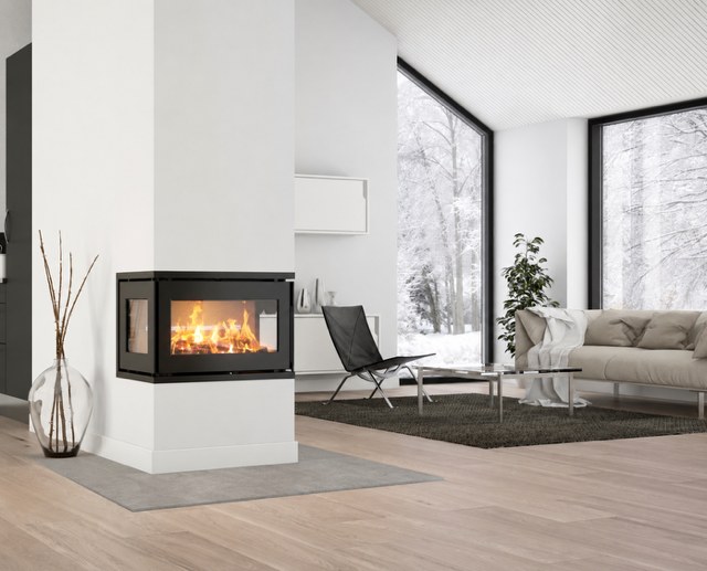 Heta Scan-Line Prestige C three-sided fire built into a divider between two zones of an open-plan room